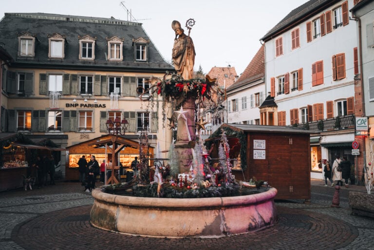 Fontaine Saint Thiébaut at the Christmas market in Thann. It's one of the best stop to add to your Alsace Christmas market itinerary.