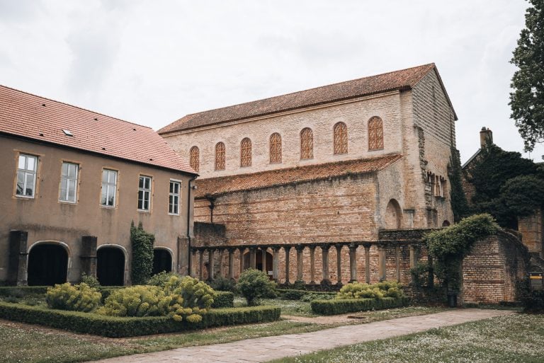 This is the Basilica of Saint-Pierre-aux-Nonnains in Metz. It's a stone chapel surrounded by gardens.