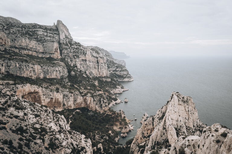 This is the view from the Belvédère de Sugiton. There are jagged limestone cliffs plugging into the sea.