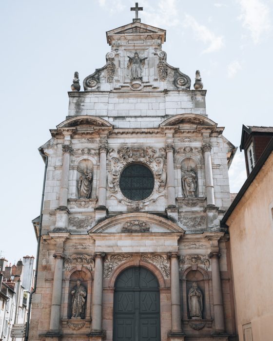 This is the exterior of the Carmelites Chapel of Dijon. It's a small stone church with intricate carvings.