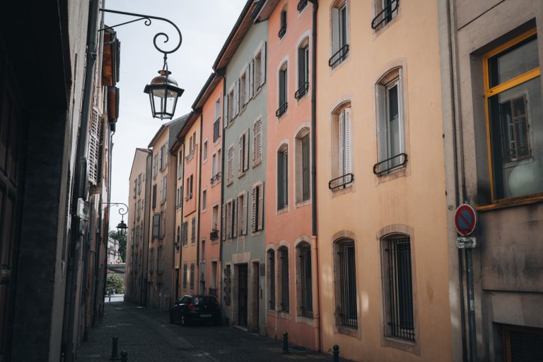 This is a set of colorful buildings along Rue du Duc Raoul in Nancy's Old Town. There are five buildings in a row and each is a different color.