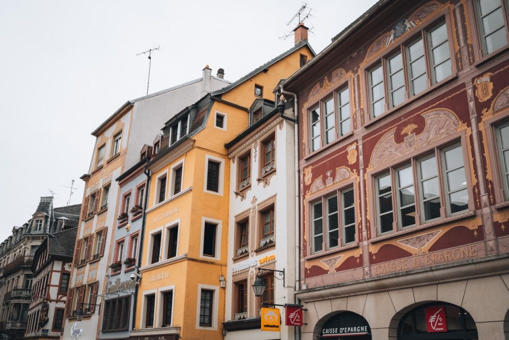 This is the row of colorful building in Place de la Réunion in Mulhouse. They are stacked side by side.