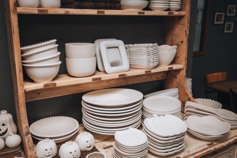 A selection of the different ceramic pieces at La Boutique des Bouleaux. There are plates, bowls, cups, and picture frames.