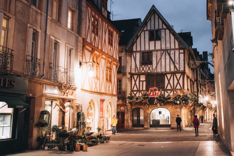 This is Dijon at night. It's an empty street. There are lights on the buildings and a few people walking around. Other than that it's very quiet.