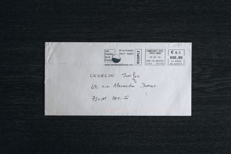 An envelope addressed to Jen Ciesielski at her address in Paris, France.