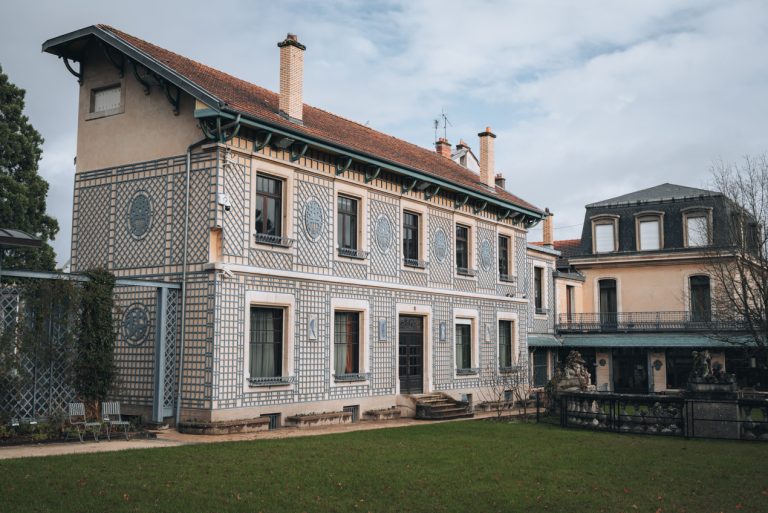 This is the exterior of the Musée de l'École de Nancy. It's a building decorated with blue lines and shapes.