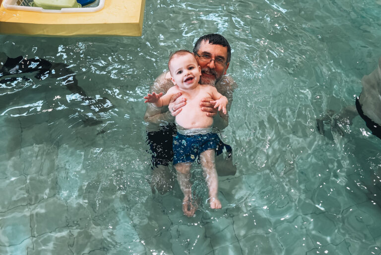 Jen's husband and son enjoying a visit to Aquaboulevard in Paris with indoor water attractions and a fun atmosphere. Spending a day at the water park is a family-friendly option in summertime.
