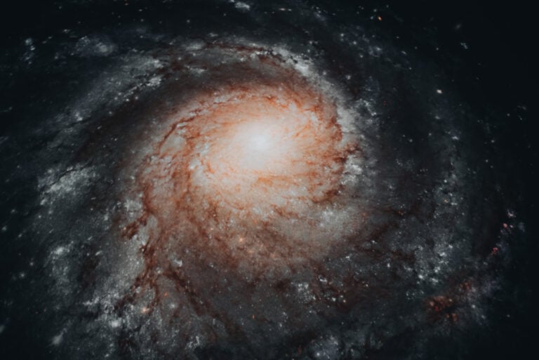 This is a photo that I took while I was watching the film Au-delà du Soleil (Beyond the Sun) at Strasbourg's Planetarium. It's a swirling galaxy that is surrounded by stars.