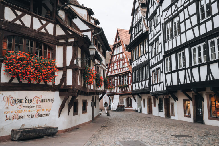 White half-timbered house line Rue du Bains aux Plantes in Strasbourg's La Petite France neighborhood.