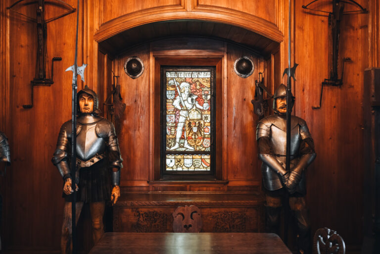 Two armed mannequins stand with armour in the Hall of Arms at the Haut-Koenigsbourg Castle.