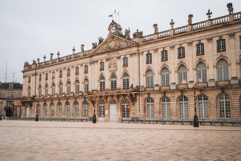This is the Hôtel de Ville in Place Stanislas in Nancy. It's a large stone building with windows and a clock at the top.