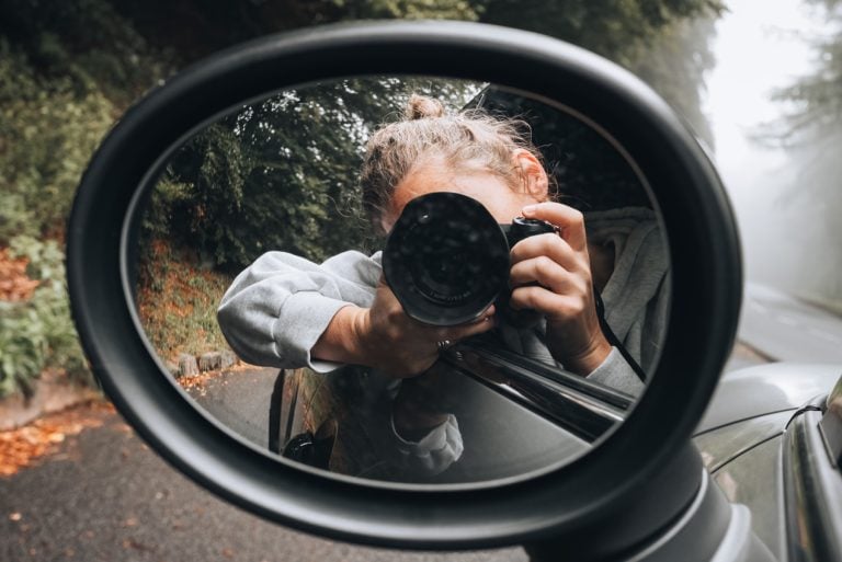 This is me, Jen Ciesielski, taking a photo of myself in the driver's side mirror. This is the car I drove from Montpelier to Strasbourg.