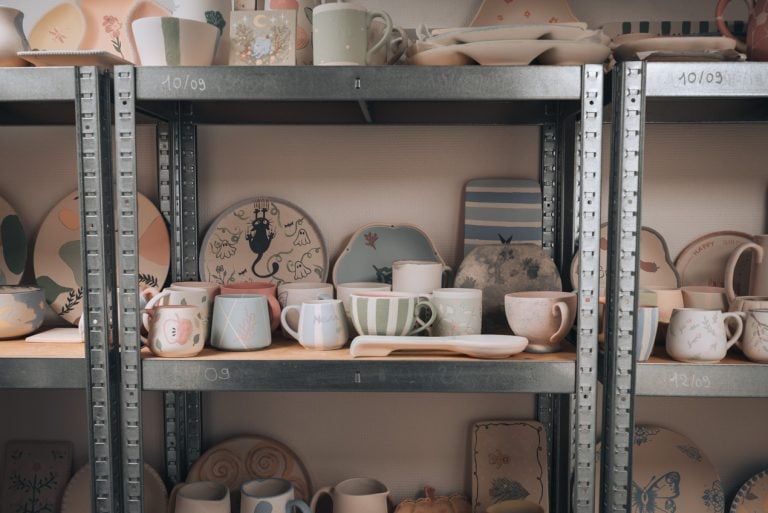 This is a selection of pottery pieces on a shelf that are getting ready to go into a fired in kiln at La Boutique des Bouleaux, which is my favorite Ceramic Cafe in Strasbourg.