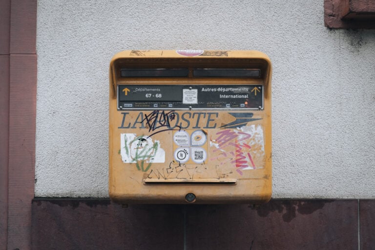 Typical La Poste Mailbox. It's a yellow box with two slots: one of local mail and one for international mail. 