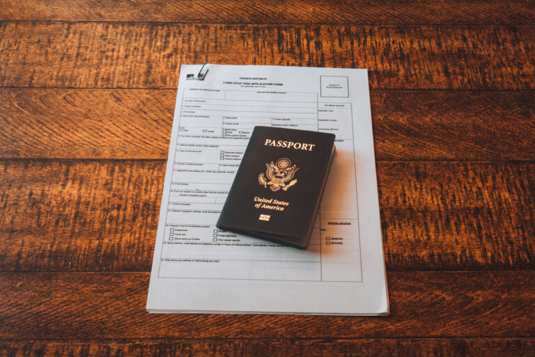 Jen's Long Stay Visa Application with her United States Passport on top of the papers. The paperwork and bureaucracy in France is one reason not to like the country. 