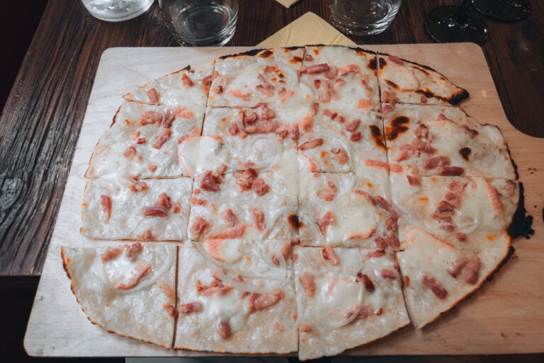 Jen's Munster Tarte Flambee from La Soi restaurant in Colmar. It's a pizza-like dish topped with Munster cheese, lardons, crème fraîche, and onions.