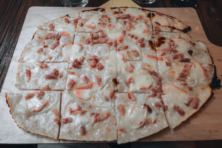 Tarte flambee from La Soi in Colmar toped with cheese, lardons, onions, and a cream sauce. It's one the foods Alsace is known for.