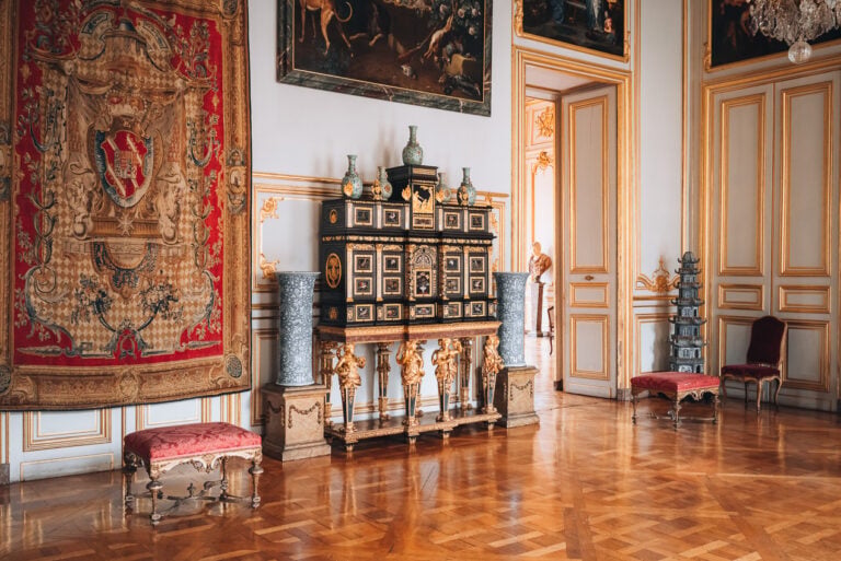 Elegant period room inside the Museum of Decorative Arts at Palais Rohan featuring antique furniture, chandeliers, and ornate décor. Visiting the museum is a great indoor activity.