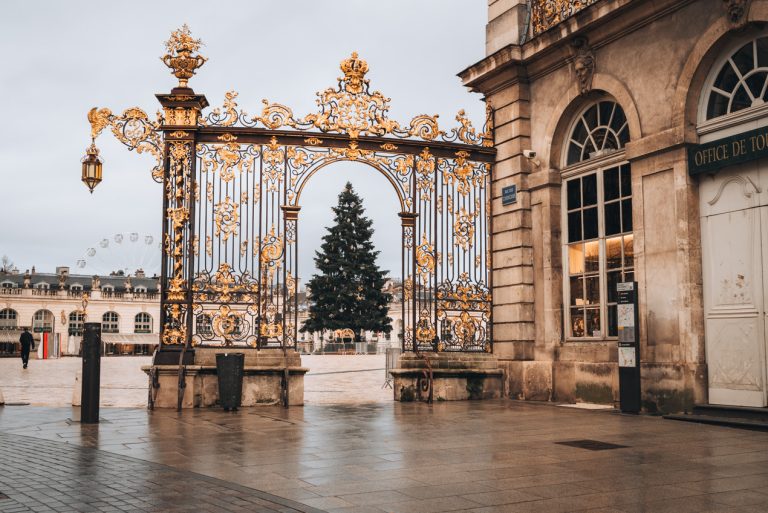 This is the gate to Place Stanislas and in between there is the Christmas tree. It's decorated for the Nancy Christmas market.