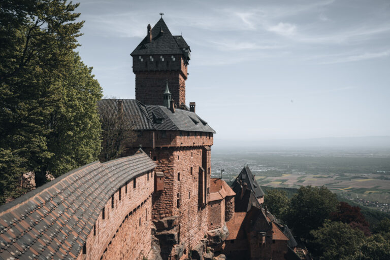 The roof of the Haut-Koenigsbourg Castle leads to it's main tower and in the distance there is the Alsatian plane.