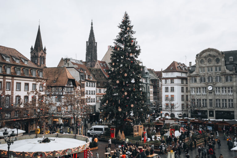 Panorama of the giant Christmas tree in Place Kléber at Christmas from the Aubette 1928. This is one of the best views of Strasbourg's Christmas market.
