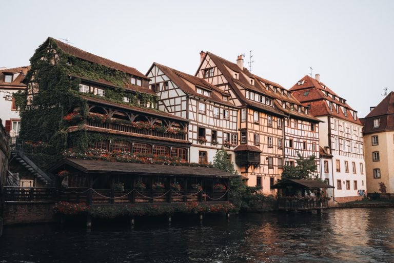 This is Pont Saint Martin at Sunrise in Strasbourg. There are four half-timbered houses lined along the canal. Each one is a different color.