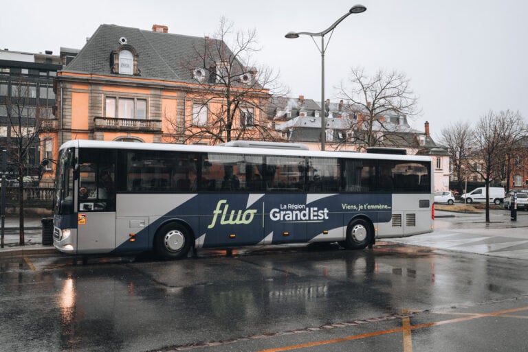This is a public bus that is parked outside the train station in Colmar. This is the kind of public bus you would take to get to Eguisheim.
