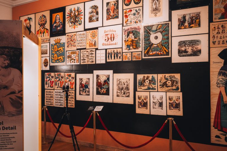 This is a selection of printed images at the Musée Westercamp in Wissembourg. There are religious, clown, and other fun images linked on a black wall.