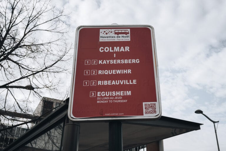 A big rectangular sign at the train station in Colmar indicates that the Navettes de Noël will go to Eguisheim.