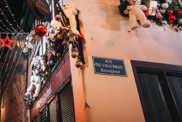 This is a street sign in Strasbourg that is written in both French and Alsatian. The street is Rue du Chaudron or Kesselgässel in Alsatian, which translates to the cauldron street in English.