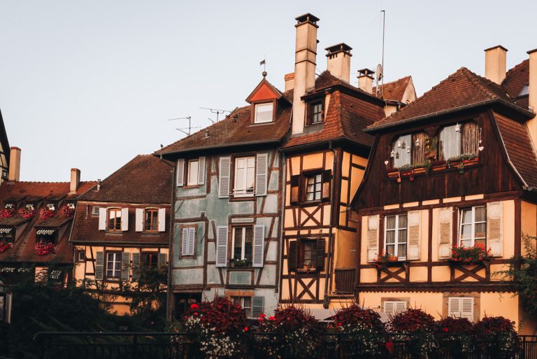 This is a series of traditional buildings in Colmar. Each one is a different color.