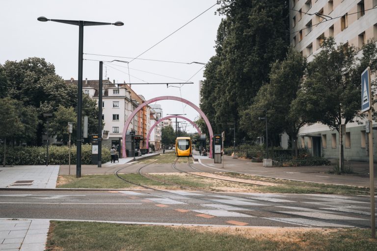 This is the tramway in Mulhouse. There is a yellow tram on the line. It makes getting around very easy.