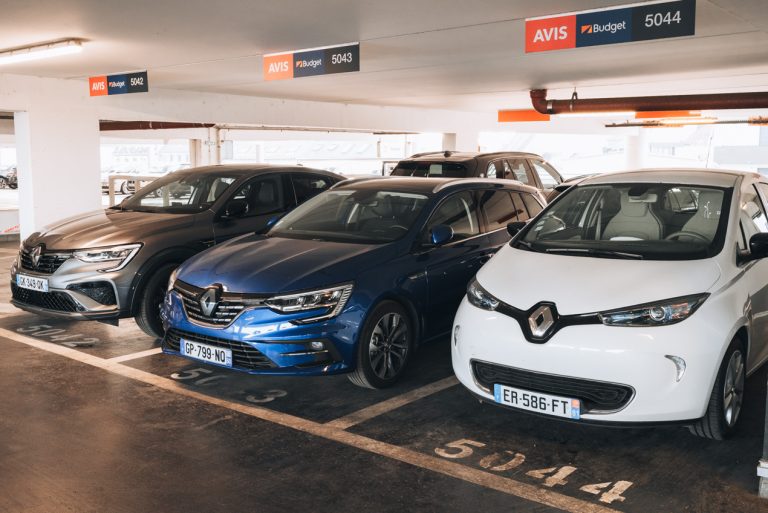 This is a row of three cars parked in the pickup section of Avis and Budget in Strasbourg. Each car is parked in a numbered spot.