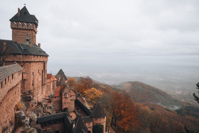This is the view of the Haut Koenigsbourg Castle from the upper terraces. There is the side of the castle on the left and the valley below on the right. 