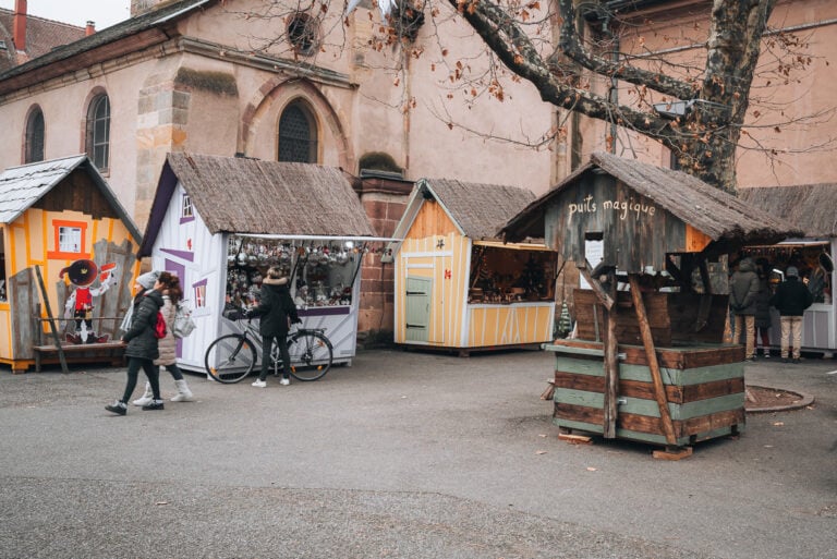 Wooden chalets at the Turckheim Christmas Market. There are four different ones and in the middle there is a well for water.