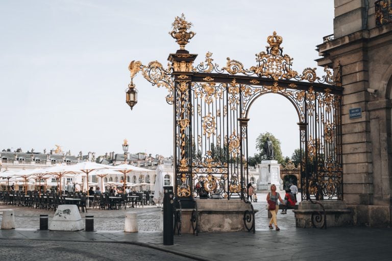 These are the wrought-iron gates at the entrance of Place Stanislas in Nancy. They are elaborately decorated with leaves and flowers and painted in gold.
